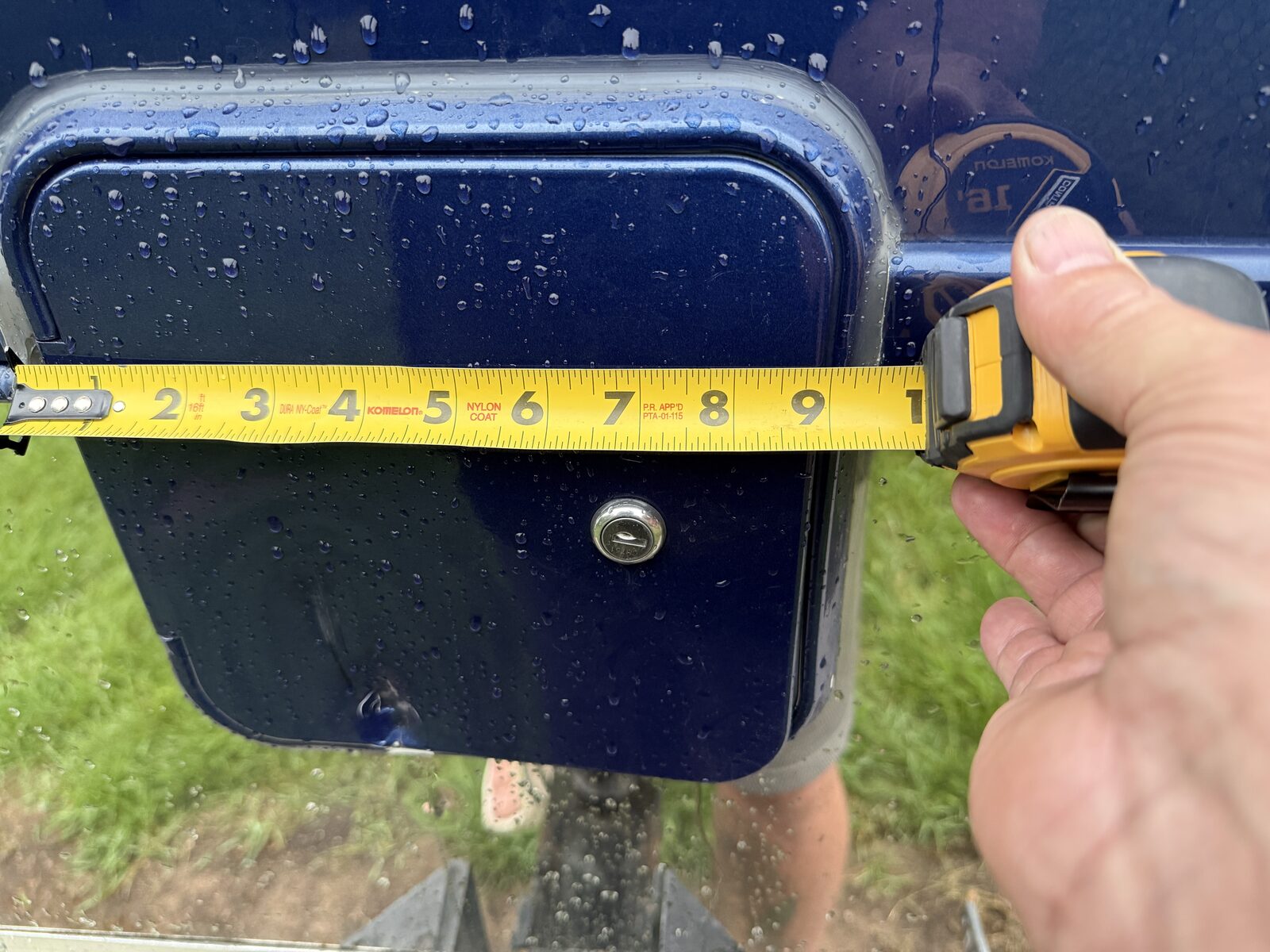 Tape measure showing the roughly nine-inch fuel door opening on a Super C motorhome