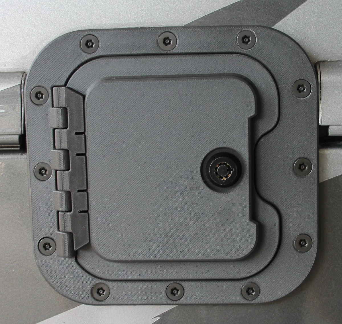 The RV Fuel Vault installed and closed on a motorhome chassis