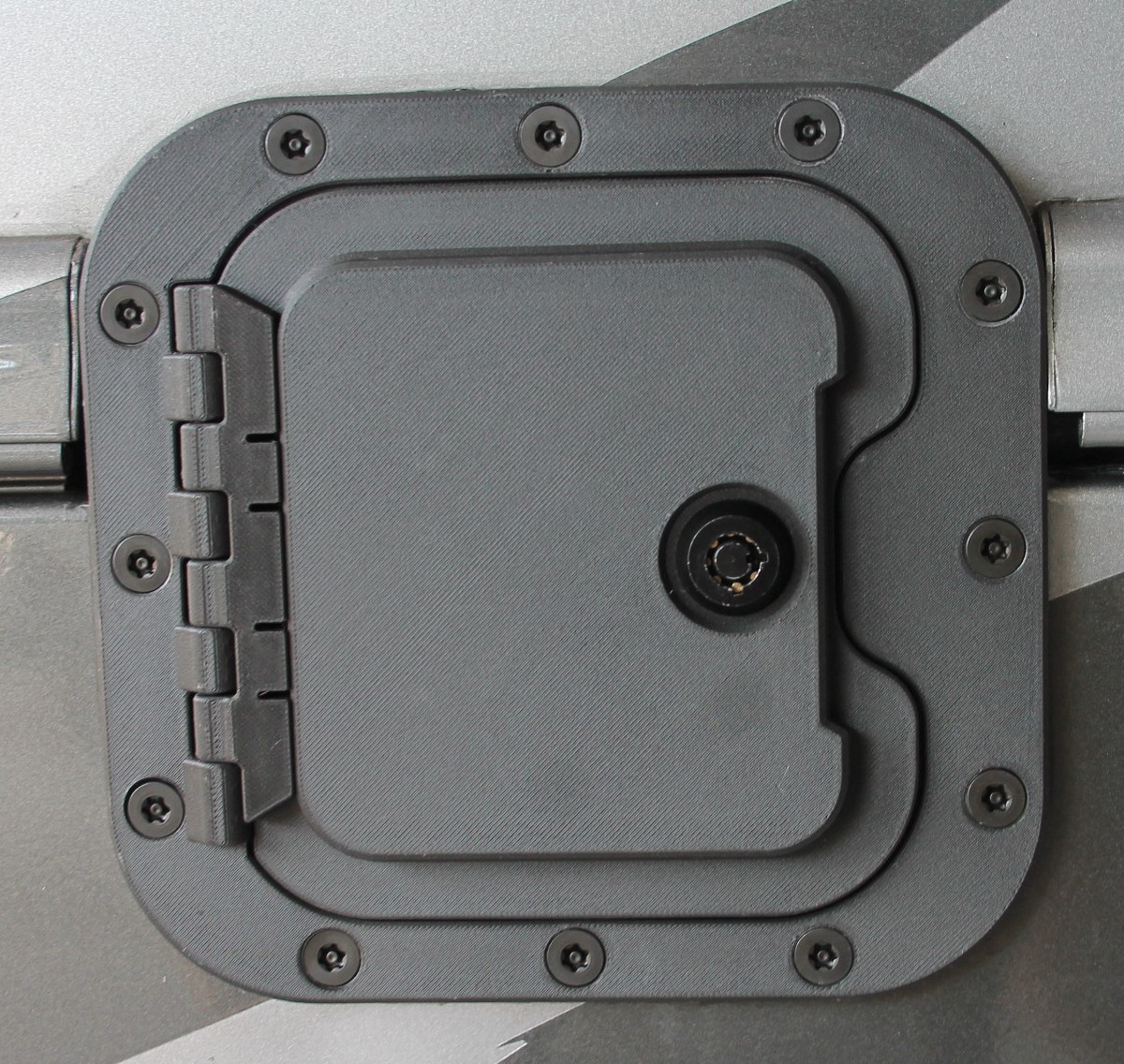 RV Fuel Vault installed — closed position showing Torx security screws and flush-mount finish