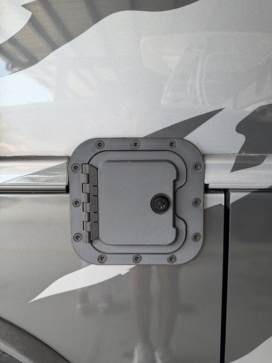 RV Fuel Vault open — diesel fuel cap access with locking hinge on Super C motorhome